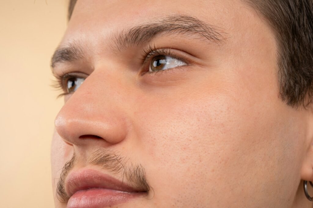 A man looking out of frame, a focus on his eyes