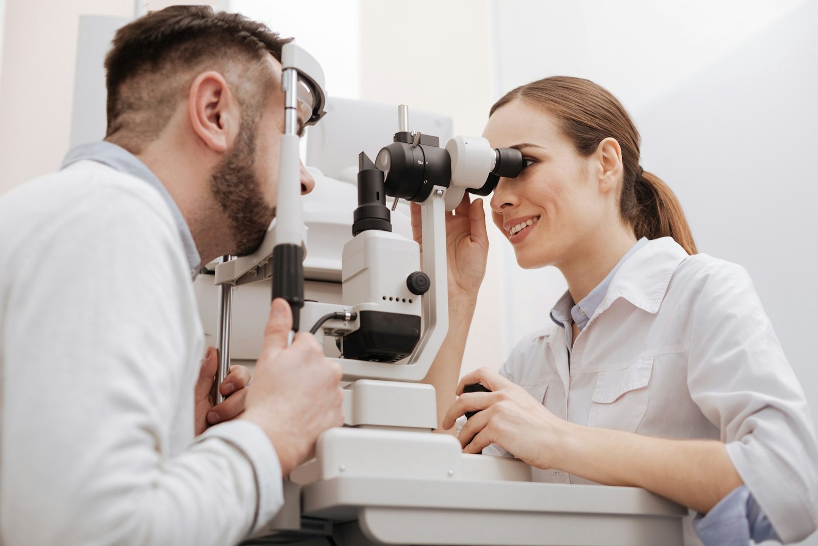 Dr. Ravi Raithatha examining a patient at the slit lamp at Vista Vision in Jersey City