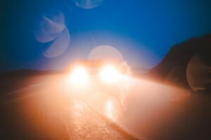 Headlights streaked and blurred while driving